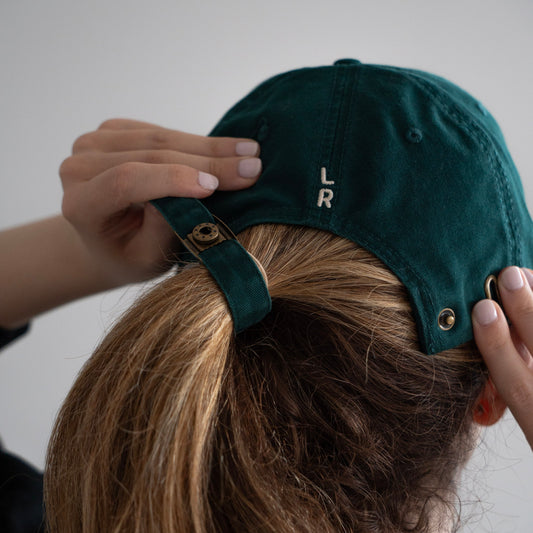 A green cap with 'Local Runner' logo embroidery
