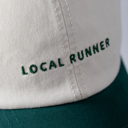 A two tone cap with 'LOCAL RUNNER' embroidery