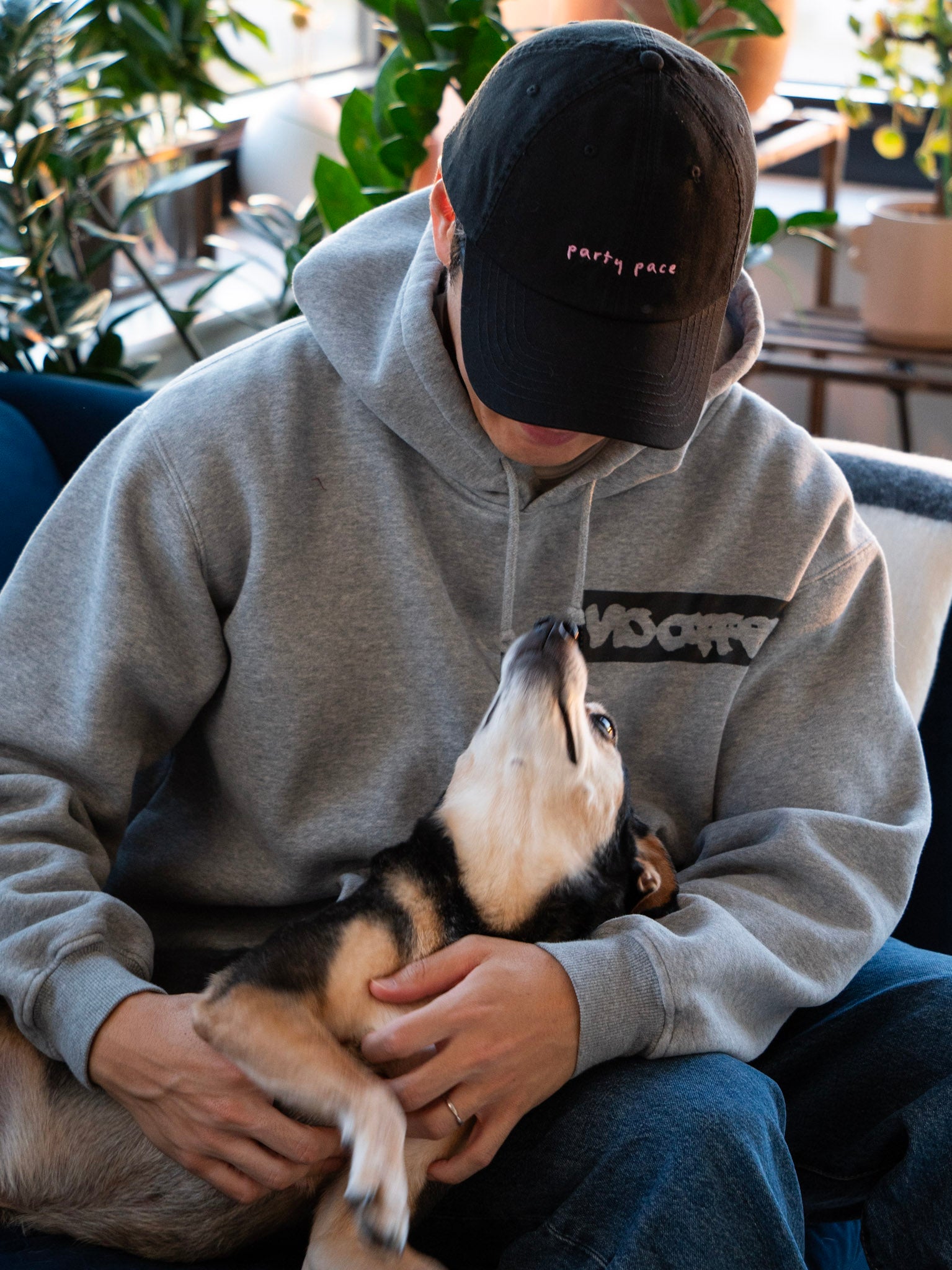 A black cap with party pace embroidery